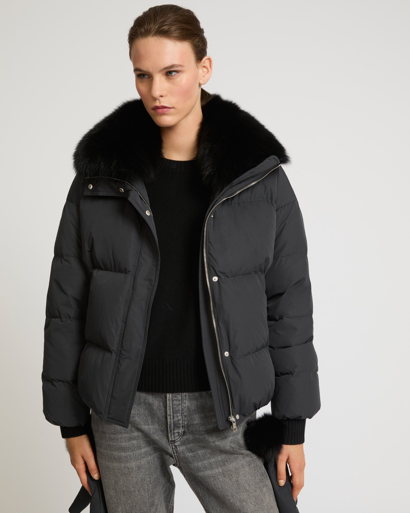 Boxy down jacket in waterproof technical fabric with fox fur