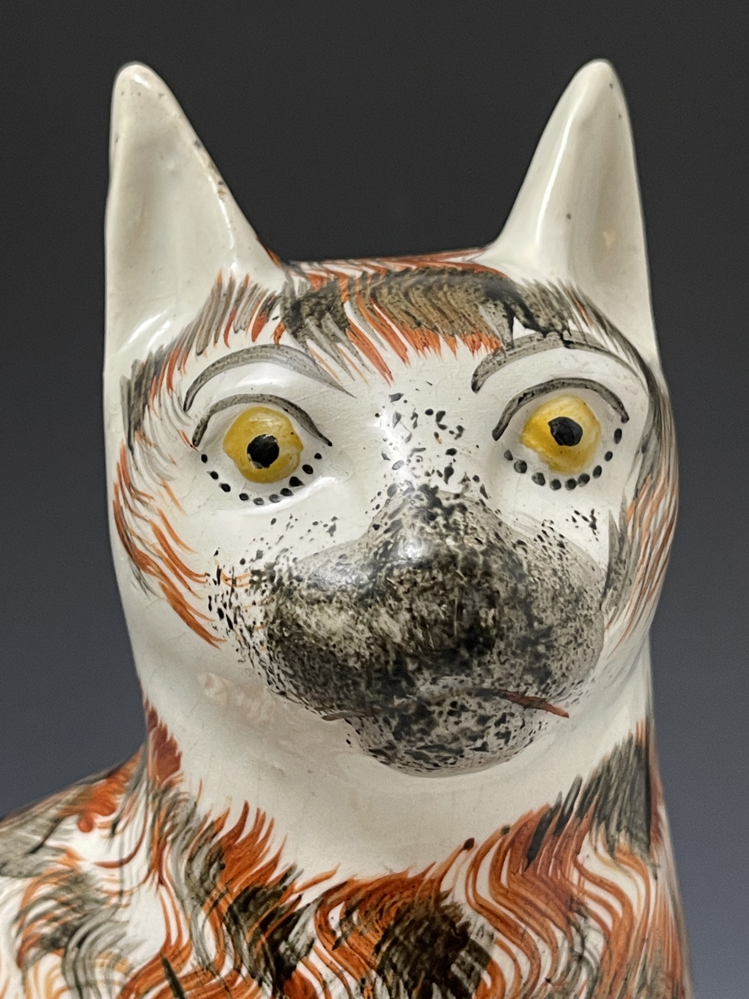 Staffordshire pottery large figure of a seated cat with a fiery