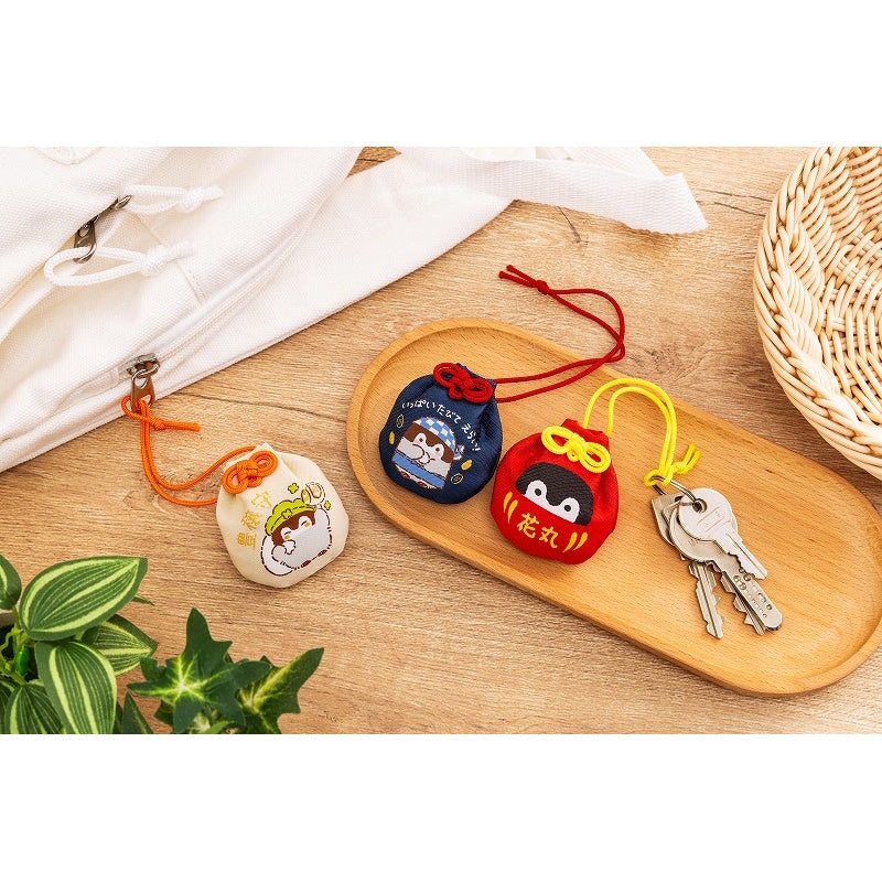 コウペンちゃん 収穫祭！ 巾着お守り（花丸だるま） – コウペンちゃん