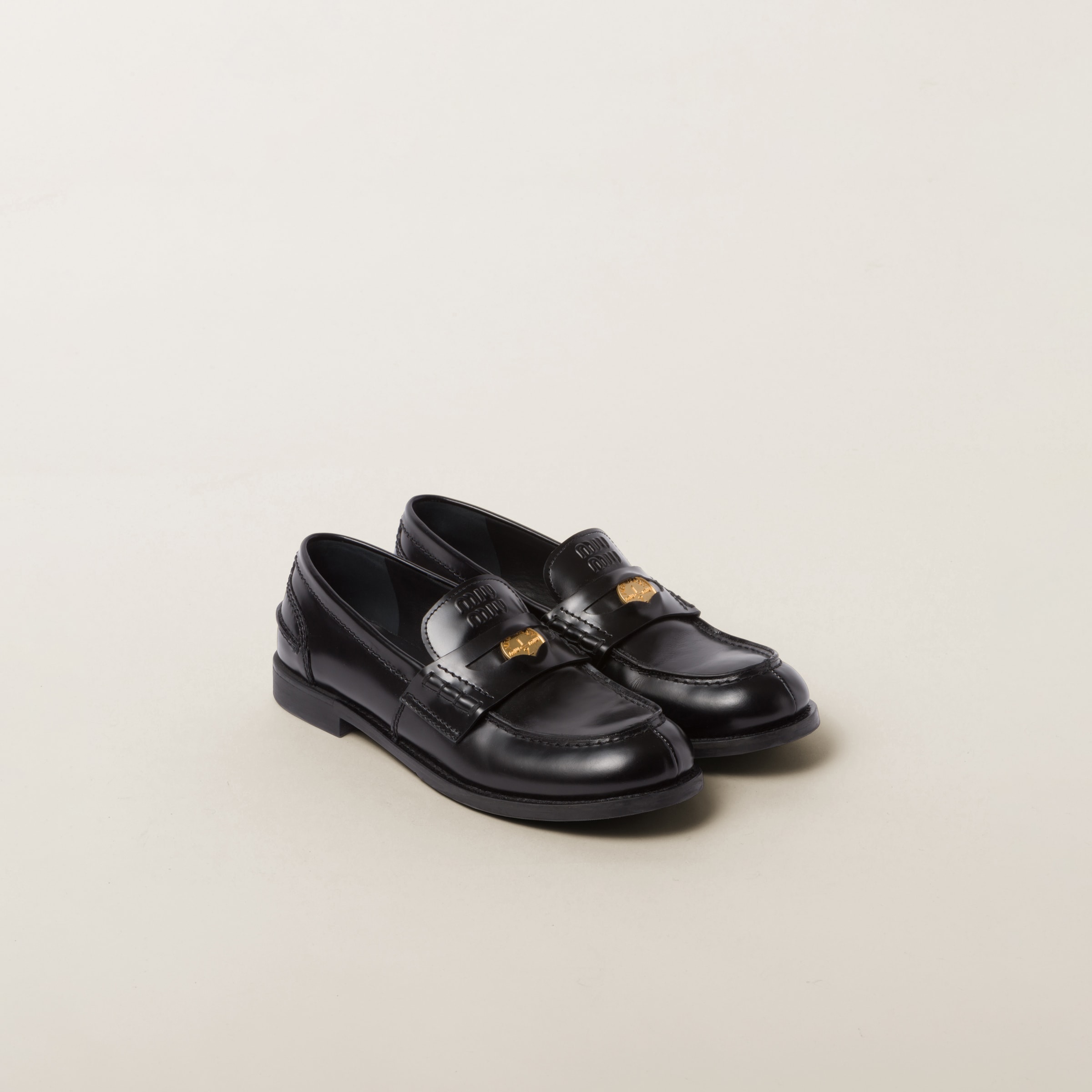 Black Brushed Leather Penny Loafers | Miu Miu