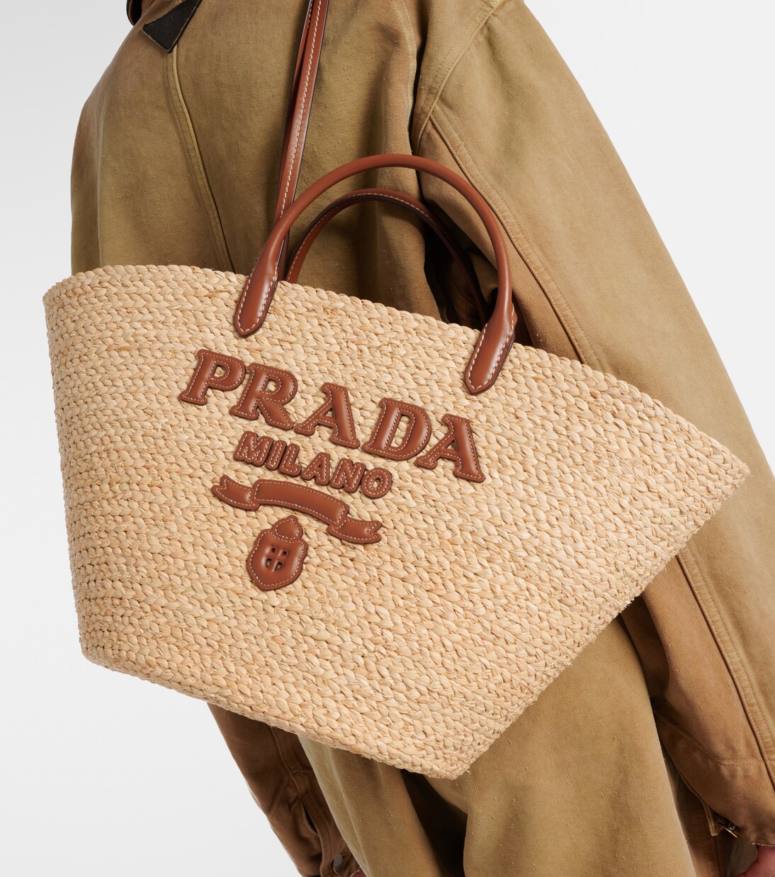 Logo leather-trimmed raffia basket bag in beige - Prada | Mytheresa