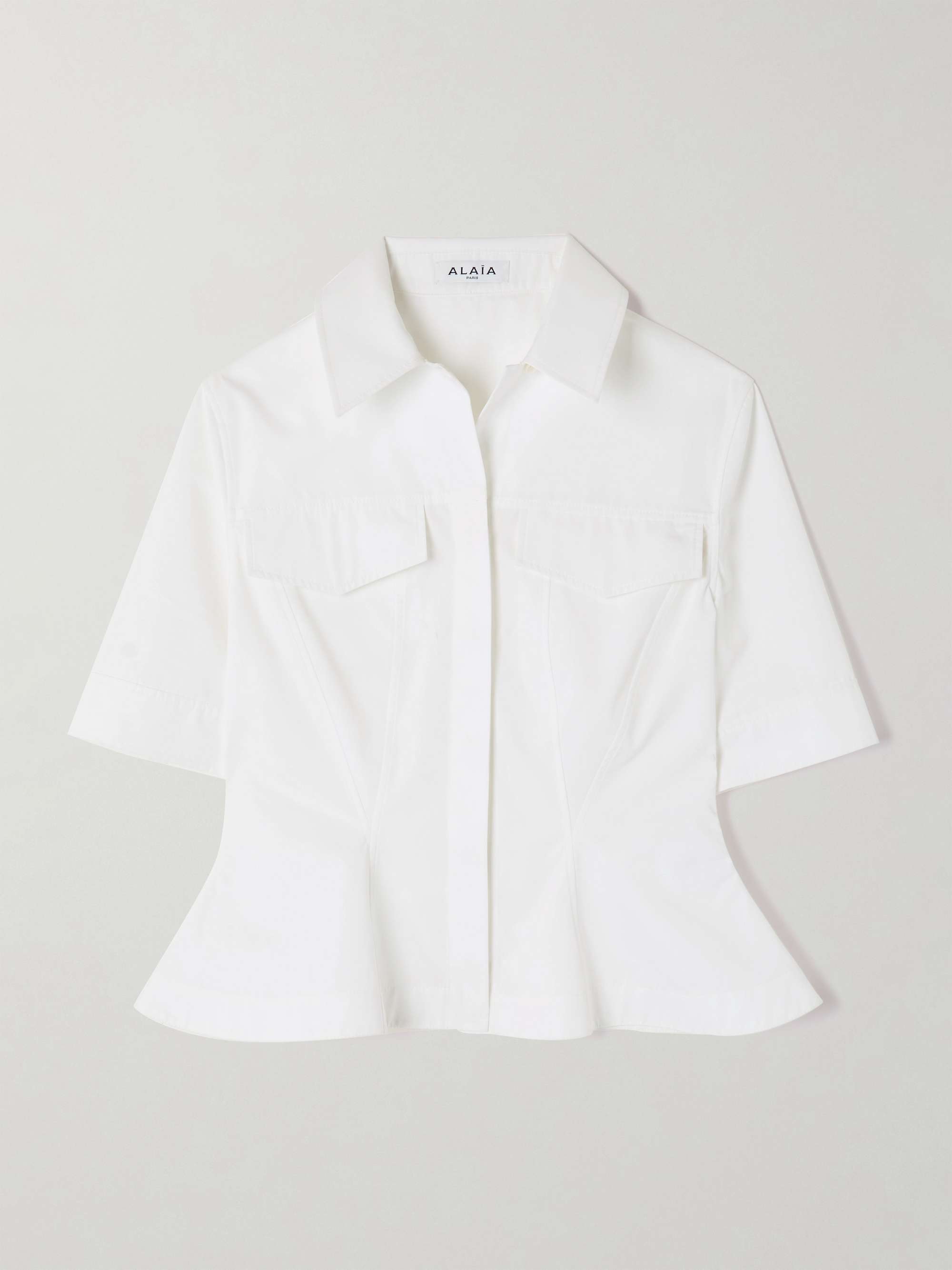 ALAÏA Paneled cotton-poplin peplum shirt | NET-A-PORTER