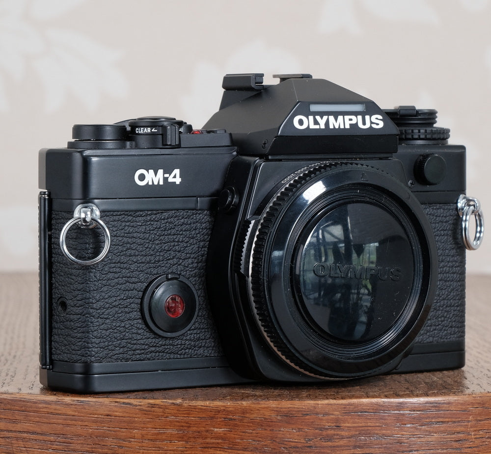 Mint! Beautiful Black Olympus OM-4 – Petrakla Classic Cameras