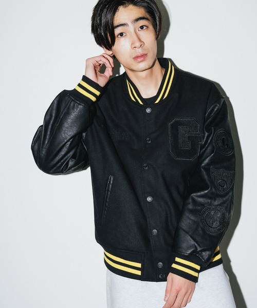 Guess（ゲス）の「GUESS/ゲス GO BATMAN Patched Varsity Jacket