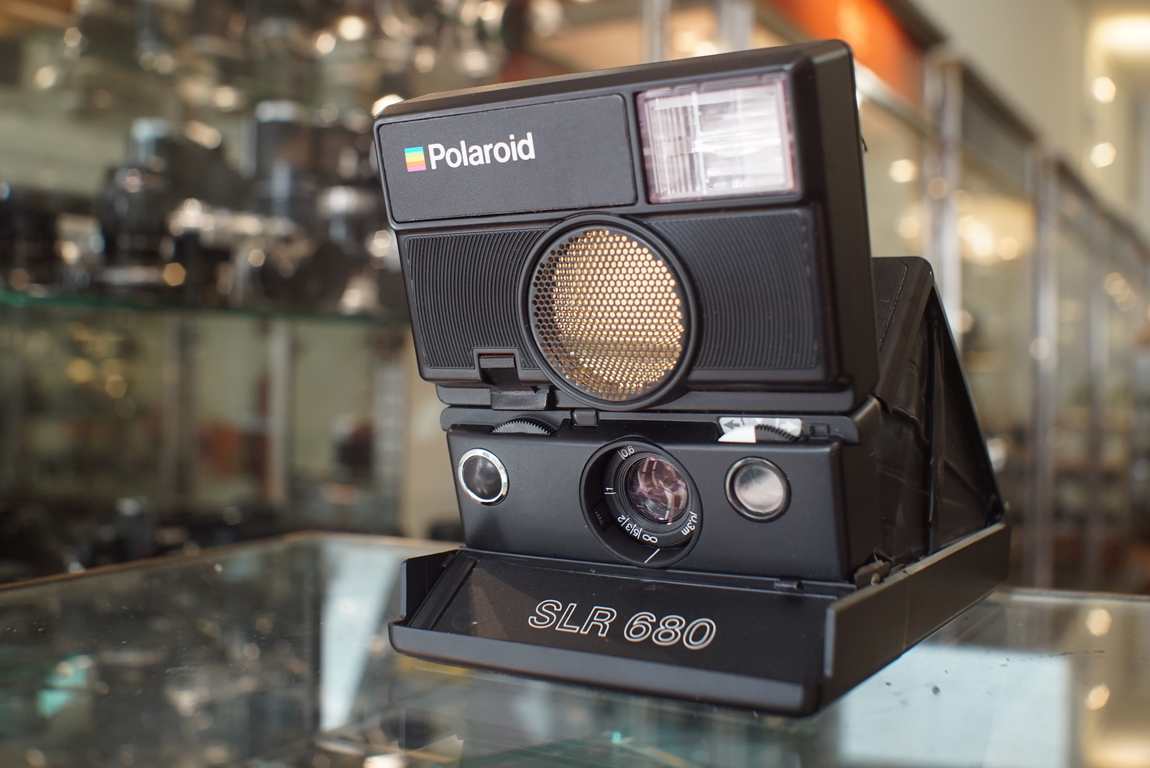 Polaroid SLR 680 instant camera black in black leather case