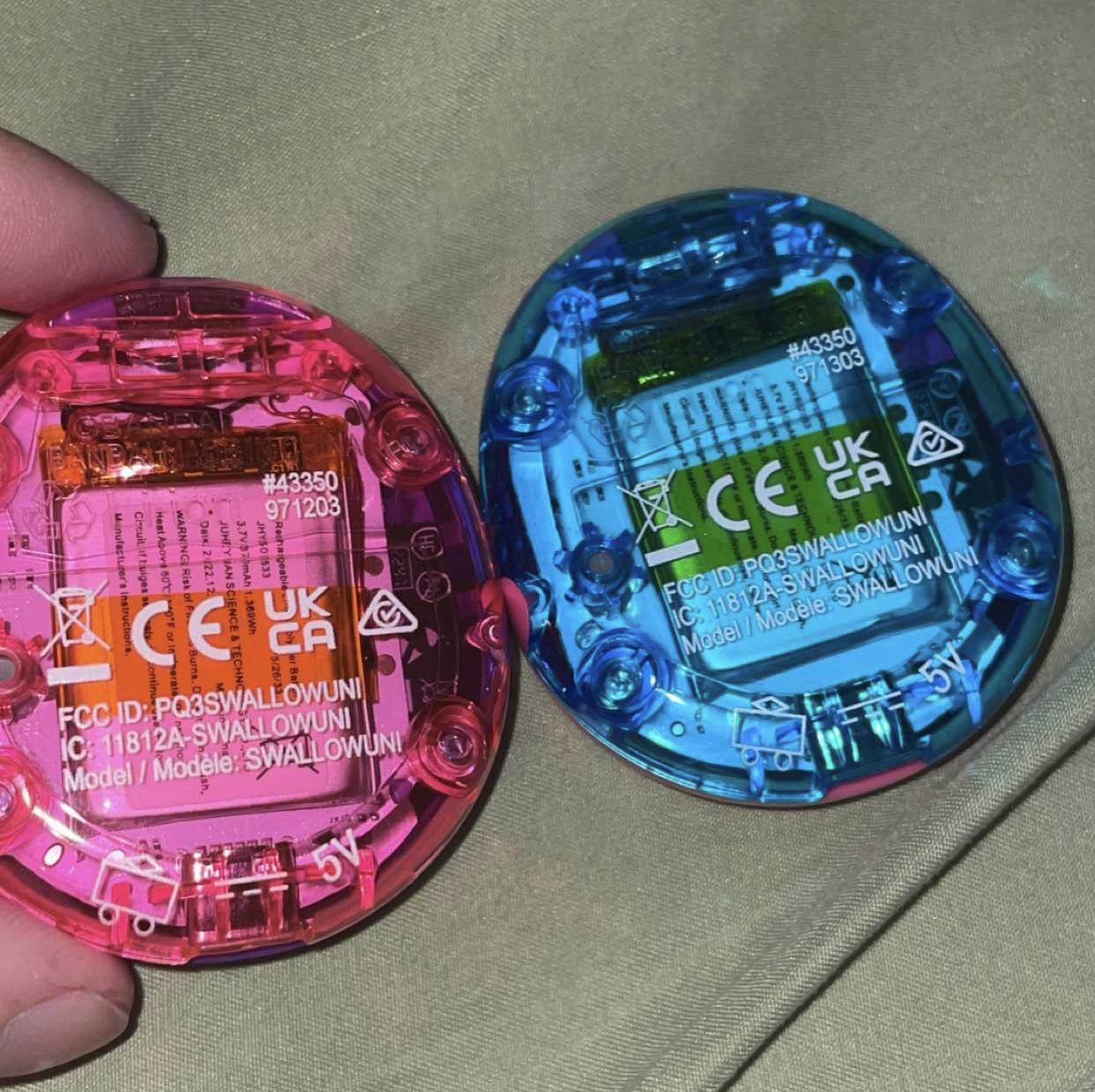 Does anyone know why they say “SWALLOWUNI” on the back? : r/tamagotchi