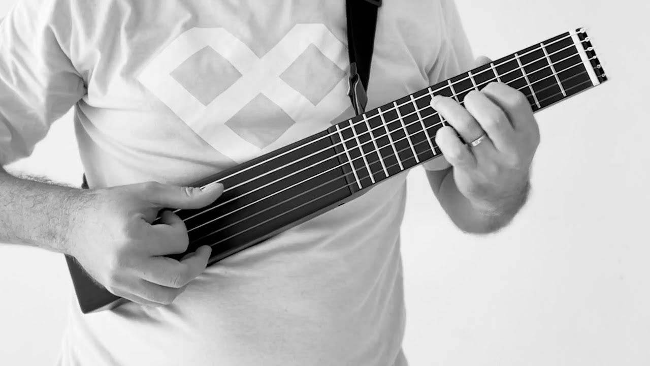 Minicorda - Suitcase-size Travel Guitar - YouTube