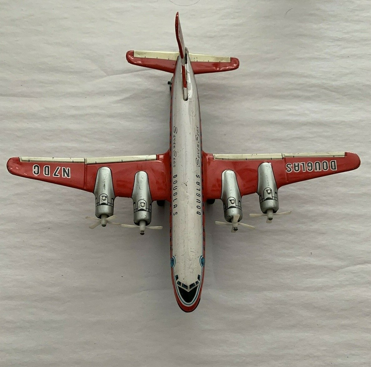 Vintage Douglas Seven Seas DC-7C Daiya Trademark Airplane Tin Toy