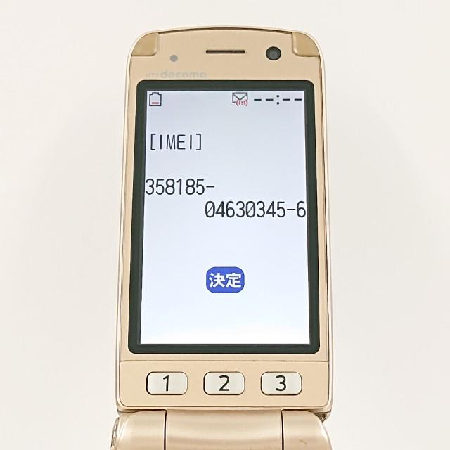 らくらくホン7 F-09B ドコモ ゴールド 送料無料 即決 本体 c15761