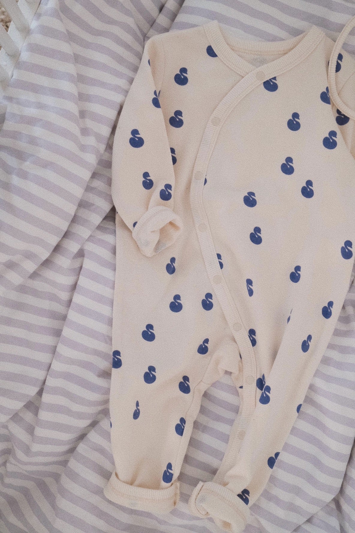 SWAN COVERALL – melted butter