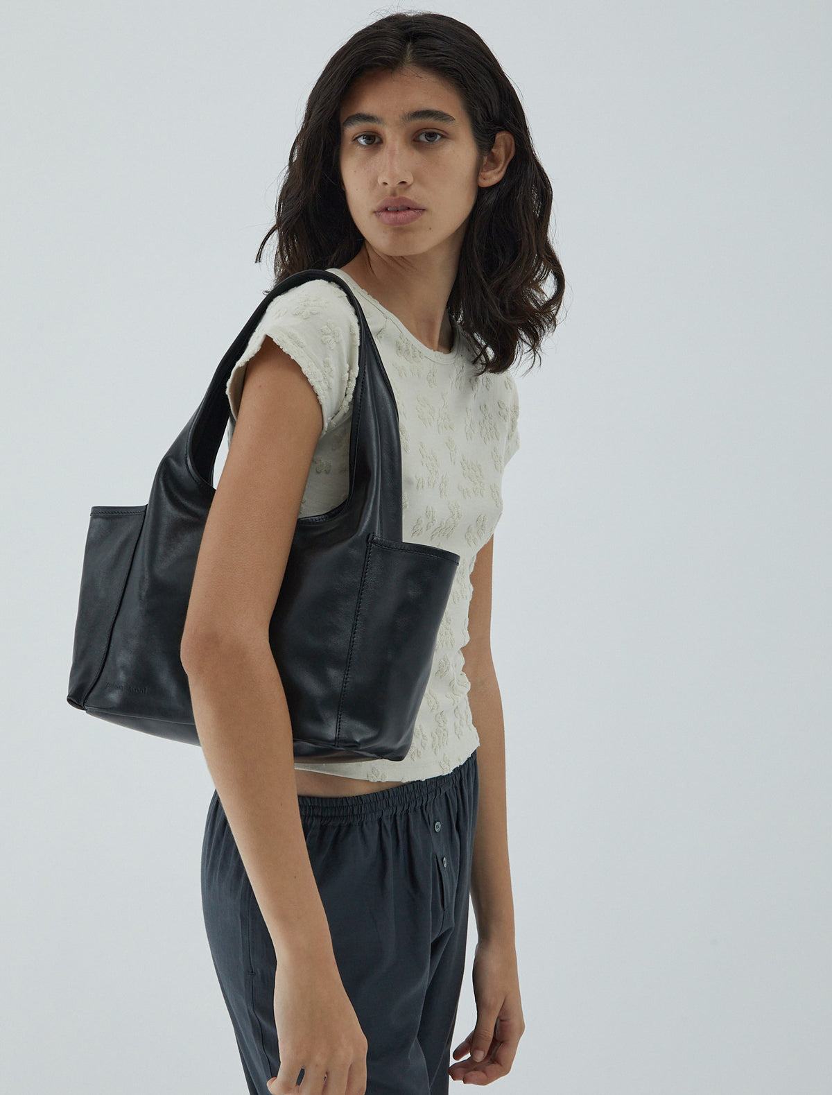 SAKURA II-Black soft, unlined bag with two exterior side pockets