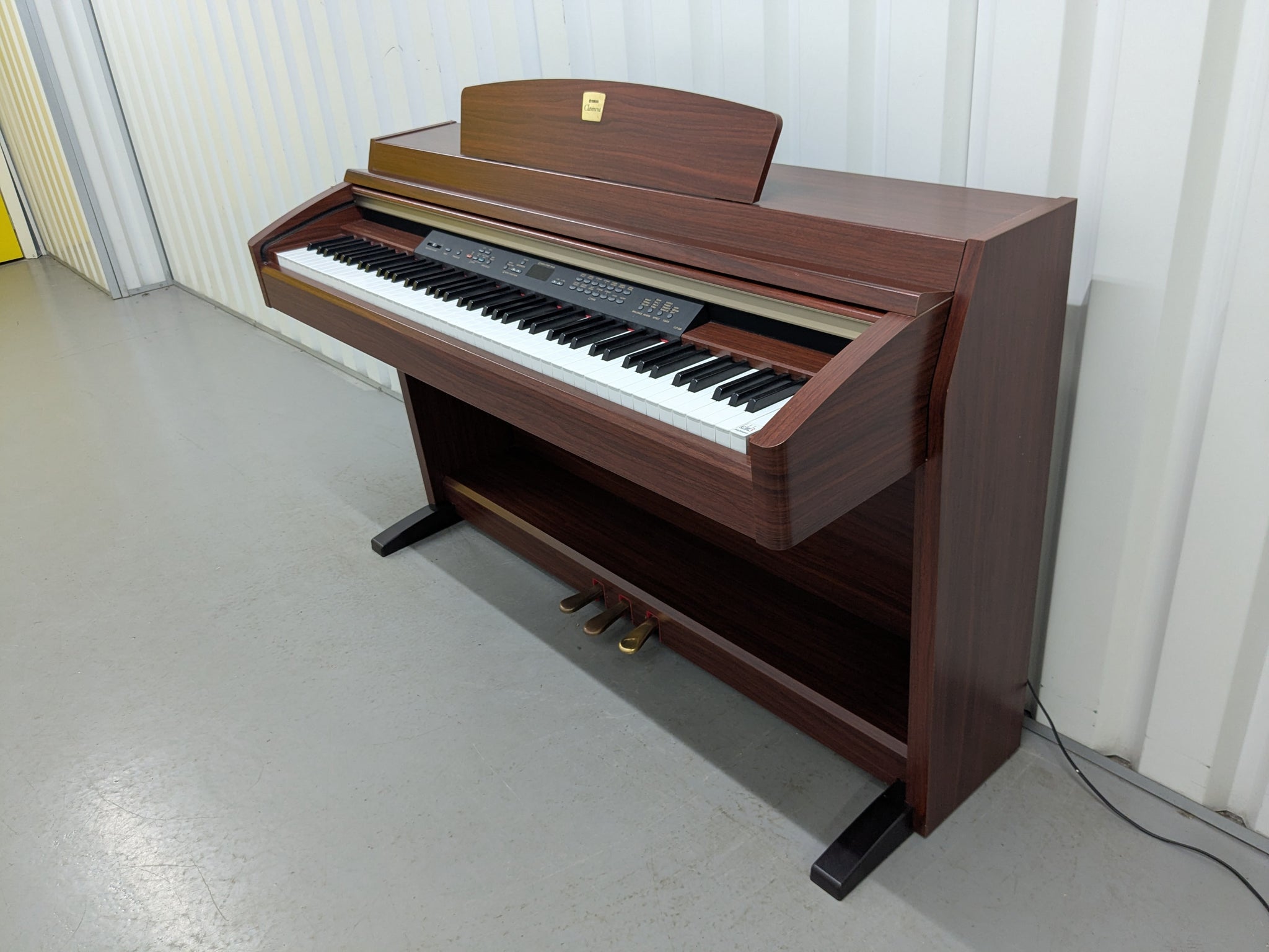Yamaha Clavinova CLP-230 digital piano in mahogany finish stock