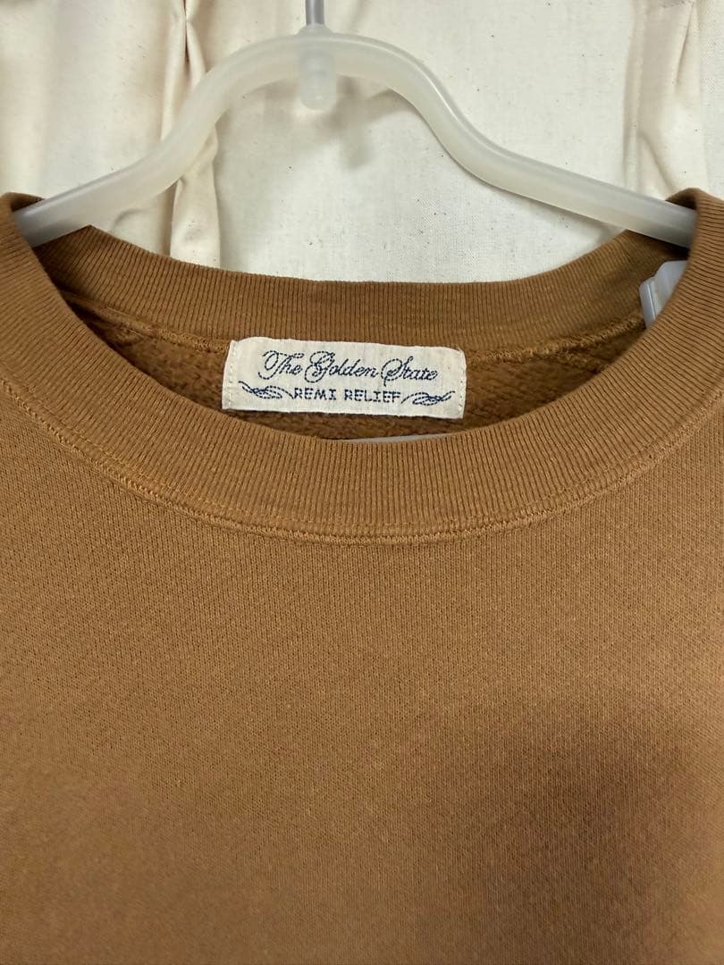 REMI RELIEF × HUG Õ WäR THIS WAYキャメル - メルカリ