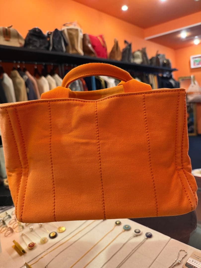 本日即決限定価格 プラダカナパミニオレンジ - メルカリ