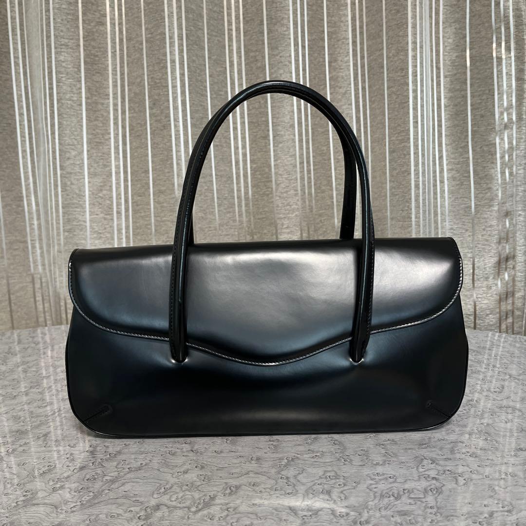 コムデギャルソン 青山オリジナルステアバック 横長 黒 - メルカリ