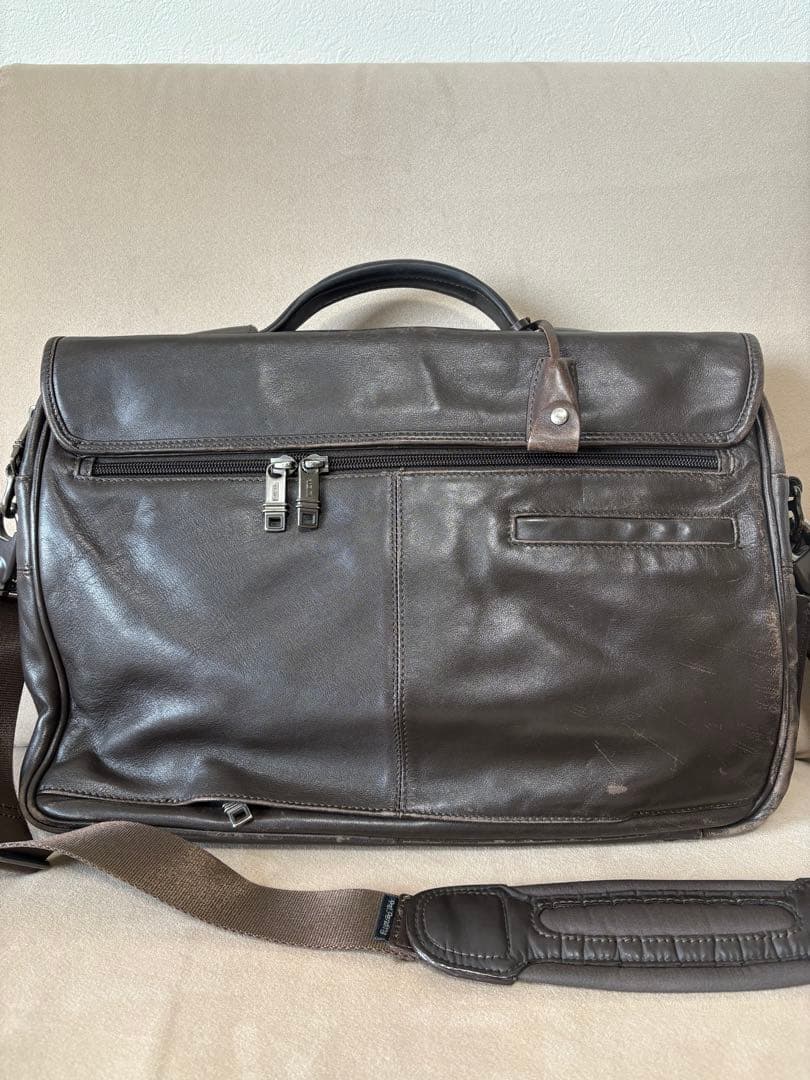 TUMI ダークブラウン レザー ビジネスバッグ - メルカリ