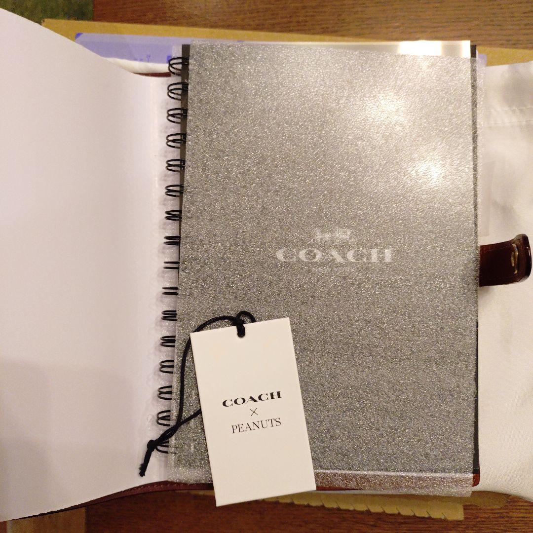 コーチ スヌーピーコラボ ノートブックシグネチャーキャンバス - メルカリ