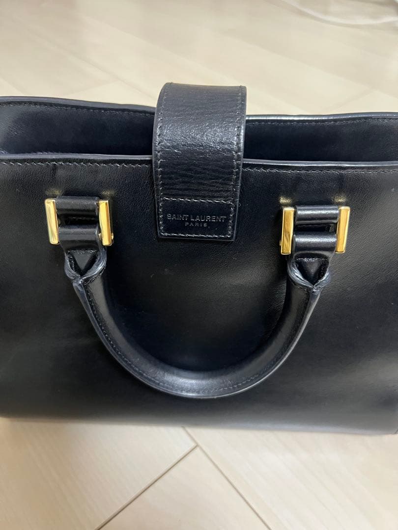 MomoCoco様SAINT LAURENT ブラックレザー ベイビーカバス - メルカリ