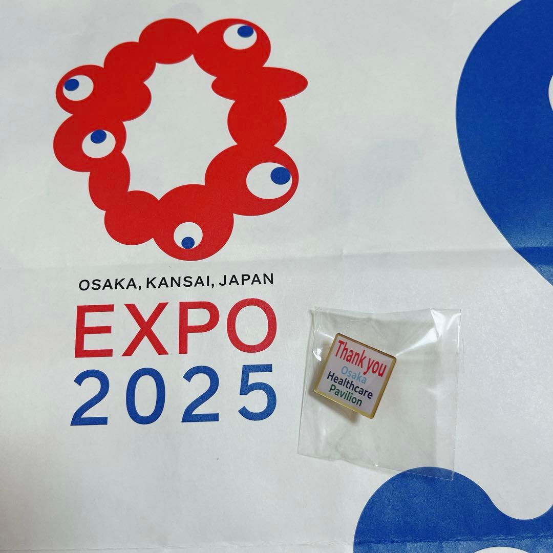 大阪ヘルスケアパビリオン ピンバッジ - メルカリ