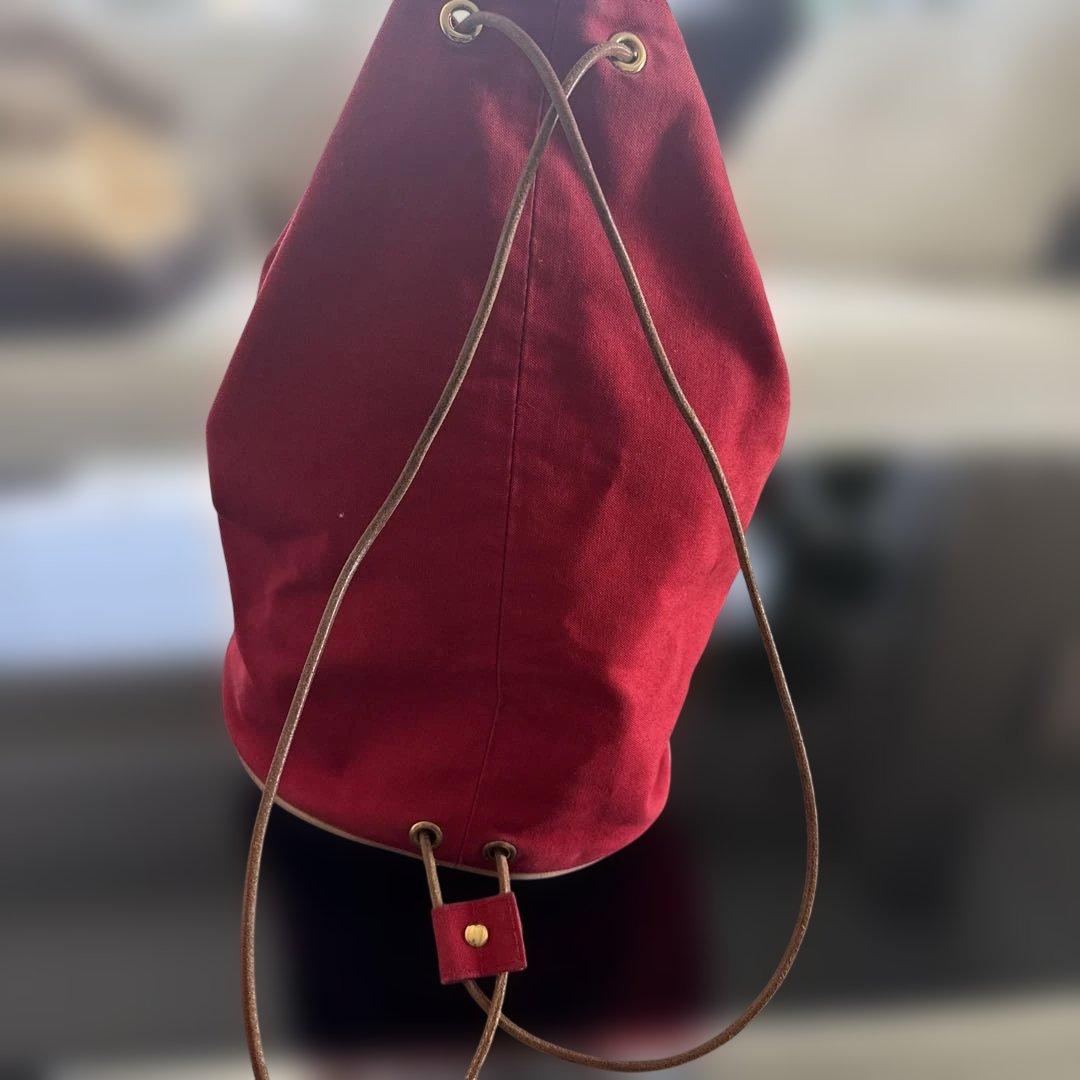 エルメス赤いキャンバスドローストリングショルダーバック